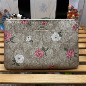 Coach Tan Wristlet with Pink Floral Design